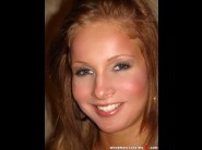 Lauryn may is sited on a sofa, legs appart and looking at you