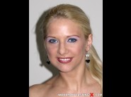 Caroline de jaie is sited on a sofa, legs appart and looking at you