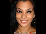 Janet joy is sited on a sofa, legs appart and looking at you