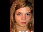 Loreen stegal is sited on a sofa, legs appart and looking at you