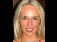 Jenny simmons is sited on a sofa, legs appart and looking at you