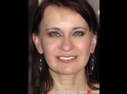 Chelsy sun is sited on a sofa, legs appart and looking at you