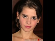 Viktoria fevari is sited on a sofa, legs appart and looking at you