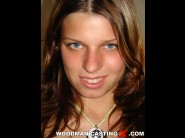 Mona lee is sited on a sofa, legs appart and looking at you