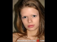 Tunde k is sited on a sofa, legs appart and looking at you