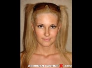 Jessica girl is sited on a sofa, legs appart and looking at you