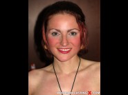 Sarah star is sited on a sofa, legs appart and looking at you