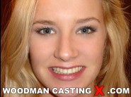 Natalli diangelo is sited on a sofa, legs appart and looking at you