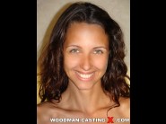 Adriana is sited on a sofa, legs appart and looking at you