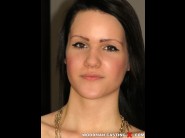 Babette is sited on a sofa, legs appart and looking at you