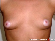 Alice x is sited on a sofa, legs appart and looking at you