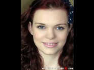 Sissy gold is sited on a sofa, legs appart and looking at you