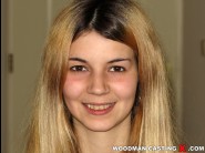 Marina del mar is sited on a sofa, legs appart and looking at you