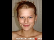 Rosses silver is sited on a sofa, legs appart and looking at you