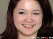 Bay dalong is sited on a sofa, legs appart and looking at you