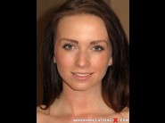 Chrissy curve is sited on a sofa, legs appart and looking at you