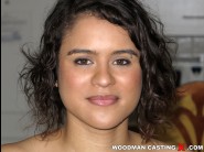 Alice axx is sited on a sofa, legs appart and looking at you