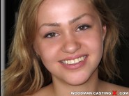 Sandy furious is sited on a sofa, legs appart and looking at you