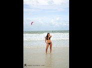 Roxy panther is sited on a sofa, legs appart and looking at you