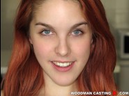 Amarna miller is sited on a sofa, legs appart and looking at you