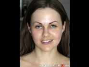 Tina kay is sited on a sofa, legs appart and looking at you