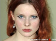 Doreen is sited on a sofa, legs appart and looking at you