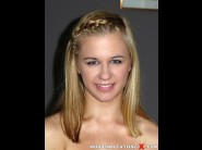 Airita smiley is sited on a sofa, legs appart and looking at you