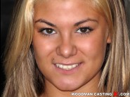 Barbara is sited on a sofa, legs appart and looking at you