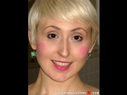 Molly dae is sited on a sofa, legs appart and looking at you