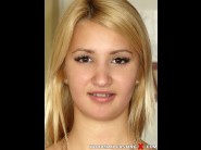 Daytona x is sited on a sofa, legs appart and looking at you