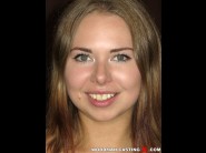 Diana dali is sited on a sofa, legs appart and looking at you