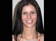 Azure storm is sited on a sofa, legs appart and looking at you