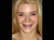 Addison avery is sited on a sofa, legs appart and looking at you