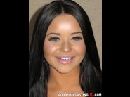 Rachele richey is sited on a sofa, legs appart and looking at you