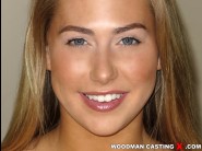 Carter cruise is sited on a sofa, legs appart and looking at you