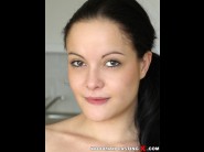 Diore is sited on a sofa, legs appart and looking at you