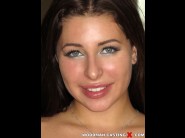 Ally breelsen is sited on a sofa, legs appart and looking at you