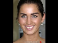 Loren minardi is sited on a sofa, legs appart and looking at you