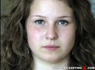 Bunny babe is sited on a sofa, legs appart and looking at you