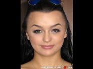 Daphne klyde is sited on a sofa, legs appart and looking at you