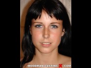 Lilly ramon is sited on a sofa, legs appart and looking at you