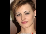 Bella charleston is sited on a sofa, legs appart and looking at you