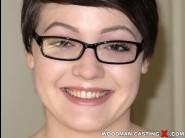 Nora belle is sited on a sofa, legs appart and looking at you