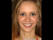 Rachel james is sited on a sofa, legs appart and looking at you