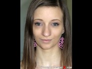 Ria hill is sited on a sofa, legs appart and looking at you