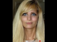 Candee licious is sited on a sofa, legs appart and looking at you