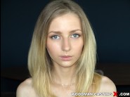 Goldie baby is sited on a sofa, legs appart and looking at you