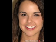  is sited on a sofa, legs appart and looking at you