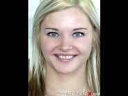 Zazie skymm is sited on a sofa, legs appart and looking at you