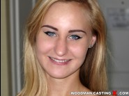 Helena valentyne is sited on a sofa, legs appart and looking at you